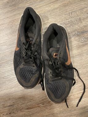 Nike Women’s Black Sneakers with Brown Swoosh